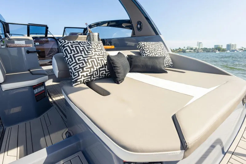 Slide: The Image of Luxurious 2026 Hanover 305 boat interior with stylish cushions and scenic water view. - 31