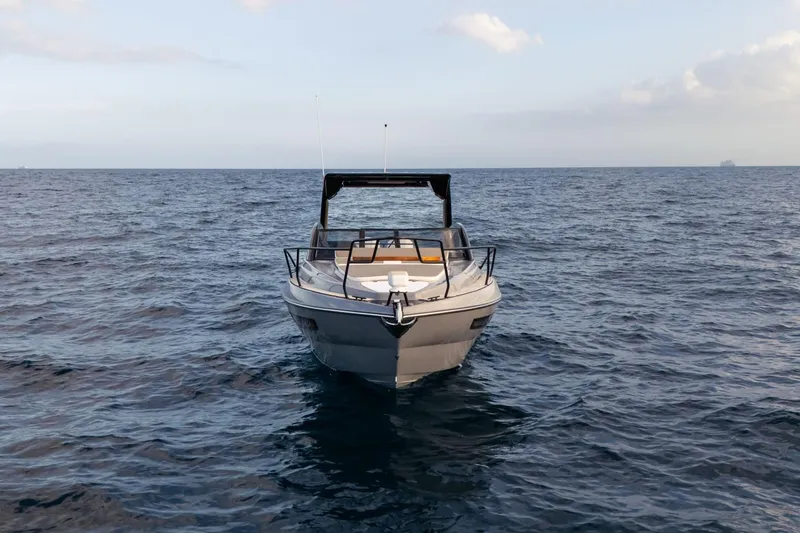 Slide: The Image of 2026 Hanover 305 boat on open sea, front view, under clear sky. - 5