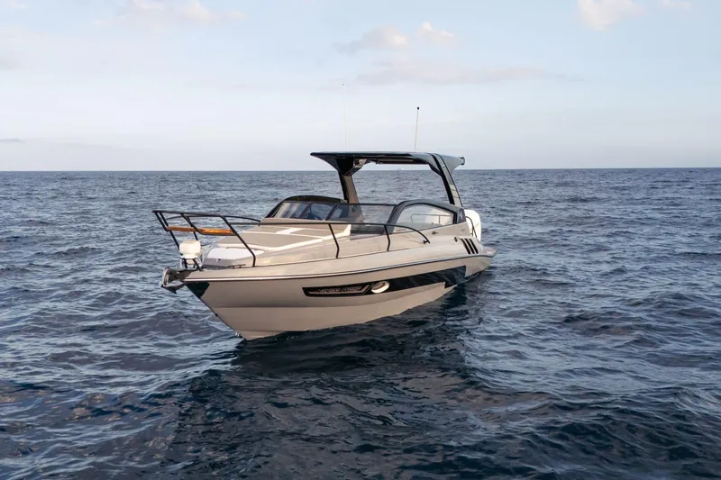 Slide: The Image of 2026 Hanover 305 boat on open sea under clear sky. - 6