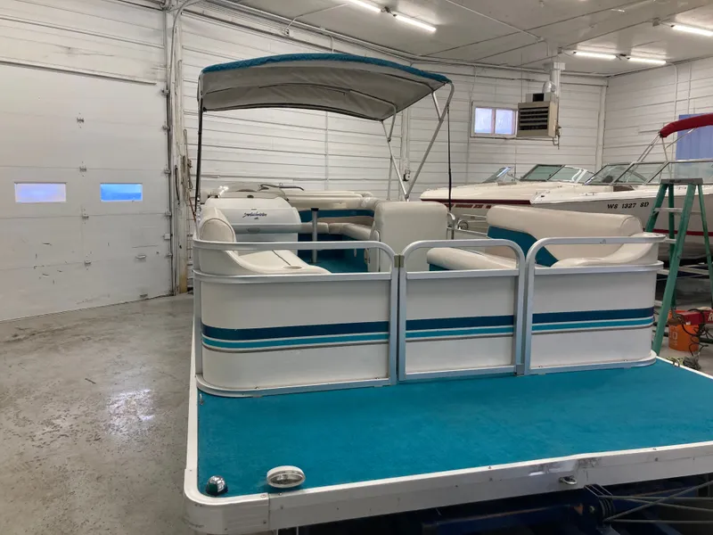 Slide: The Image of 2000 Godfrey Sweetwater 24ELITE pontoon boat in a garage. - 10