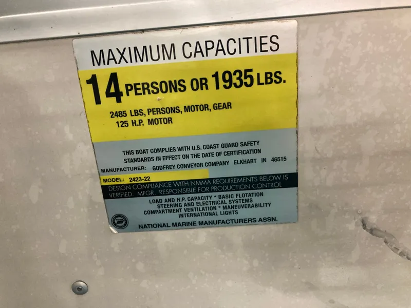 Slide: The Image of Safety label of 2000 Godfrey Sweetwater 24ELITE with capacity details. - 32