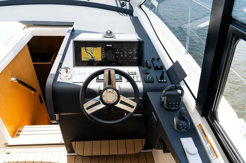 Slide: The Image of 2022 Bavaria SR41 yacht helm with navigation system and controls. - 10