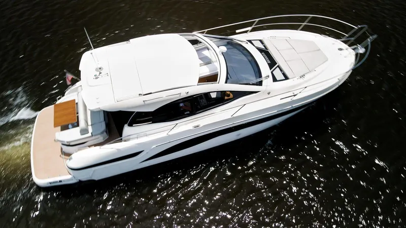 Slide: The Image of 2022 Bavaria SR41 yacht cruising on water, aerial view. - 3