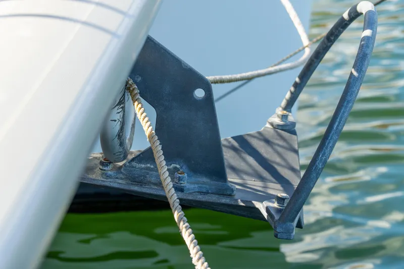Slide: The Image of Close-up of 2023 Lagoon 46 catamaran anchor detail with rope in water. - 109