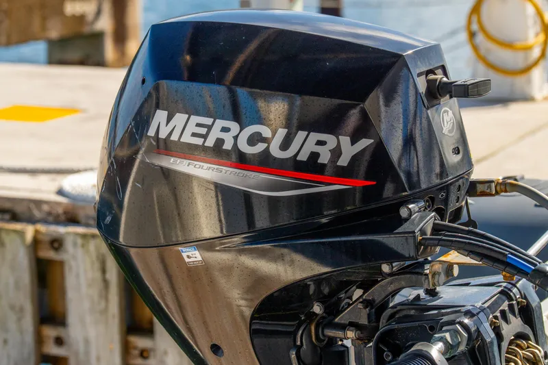 Slide: The Image of Mercury EFI FourStroke outboard motor on a 2023 Lagoon 46 yacht at dock. - 113