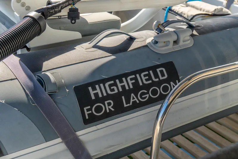 Slide: The Image of Highfield inflatable boat for Lagoon 46, 2023 model, docked with equipment. - 114