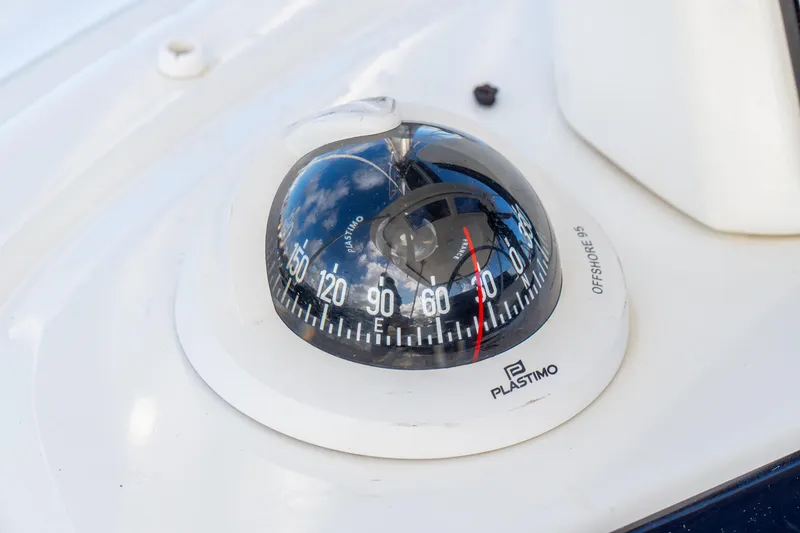 Slide: The Image of Compass on 2023 Lagoon 46 yacht, featuring Plastimo Offshore 95 model. - 18