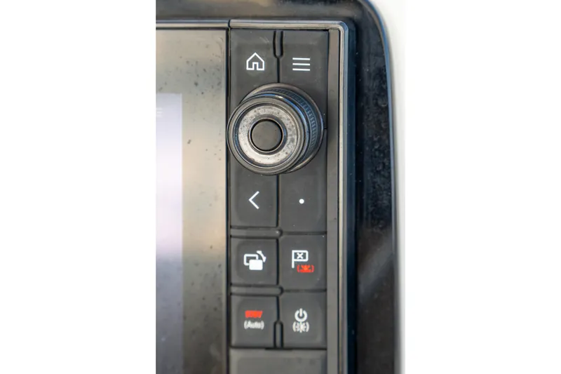 Slide: The Image of Control panel of 2023 Lagoon 46 yacht with navigation buttons and dial. - 21