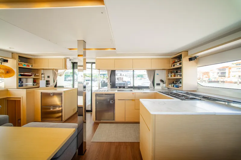 Slide: The Image of Modern interior of 2023 Lagoon 46 yacht with spacious kitchen and sleek design. - 35