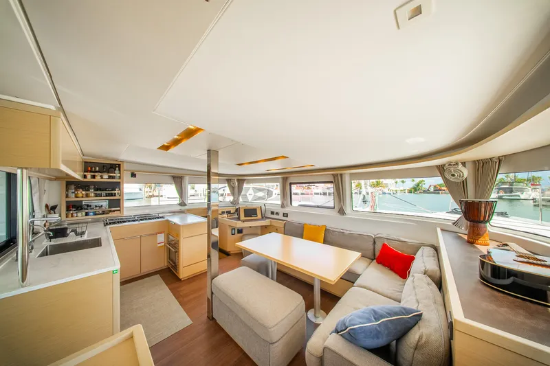 Slide: The Image of Luxurious interior of 2023 Lagoon 46 catamaran with modern kitchen and cozy seating area. - 38