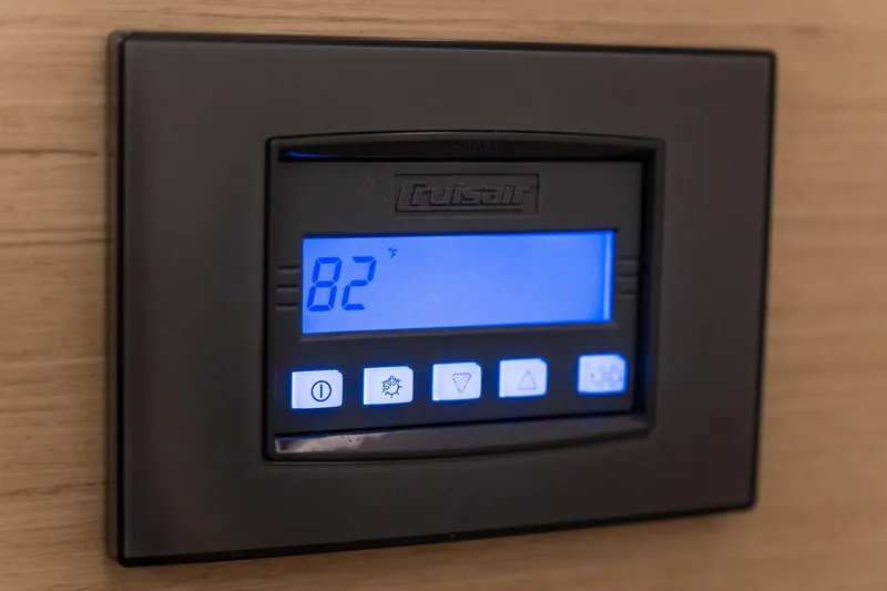 Slide: The Image of Digital thermostat display on 2023 Lagoon 46 yacht, showing 82 degrees Fahrenheit. - 53