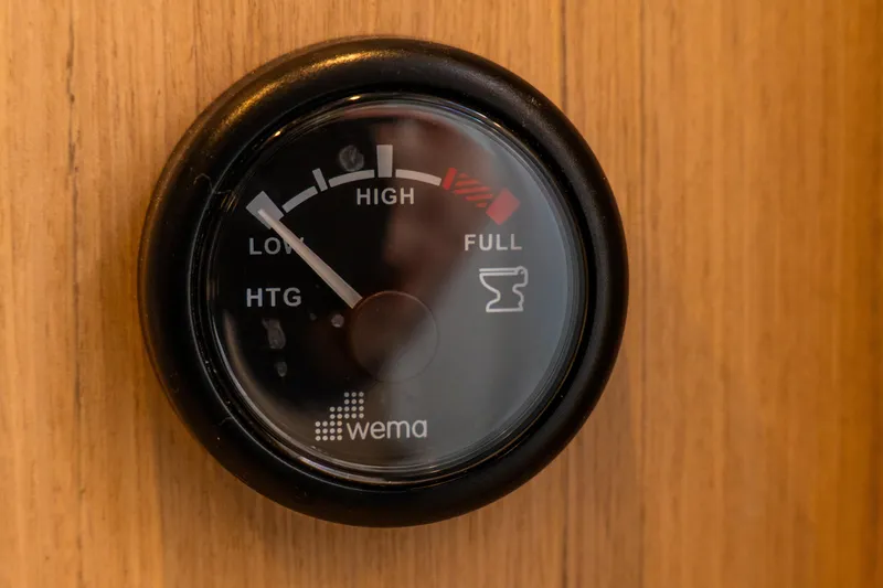 Slide: The Image of Gauge on 2023 Lagoon 46 yacht, indicating tank levels from low to full. - 61