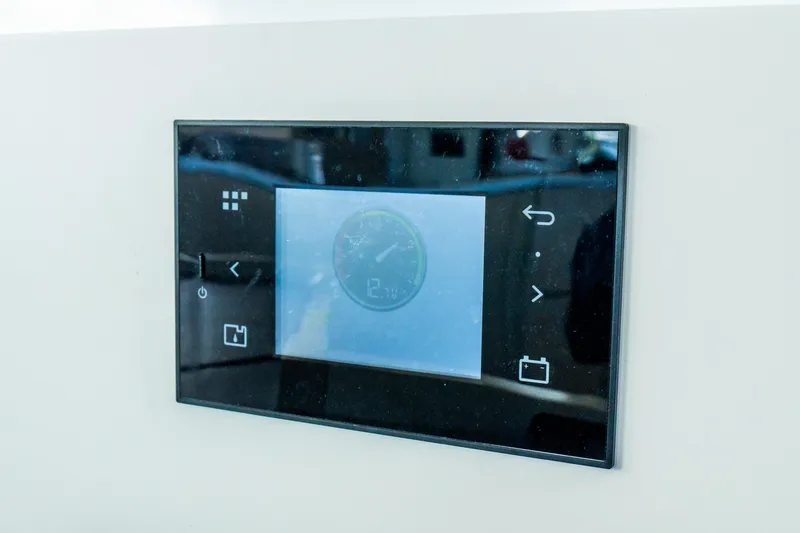 Slide: The Image of Touchscreen control panel on 2023 Lagoon 46 yacht, displaying navigation and system settings. - 66
