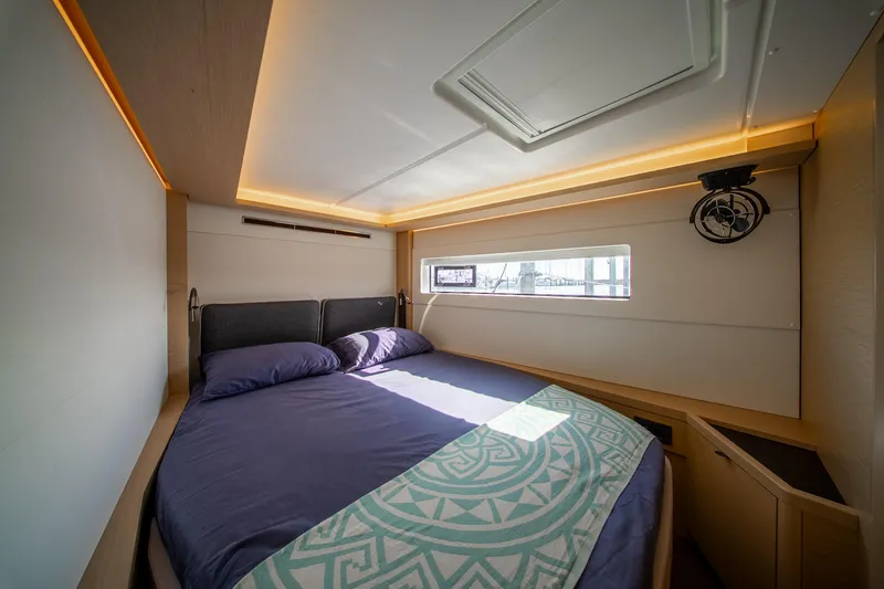 Slide: The Image of Luxurious cabin interior of 2023 Lagoon 46 yacht with modern design and ambient lighting. - 69