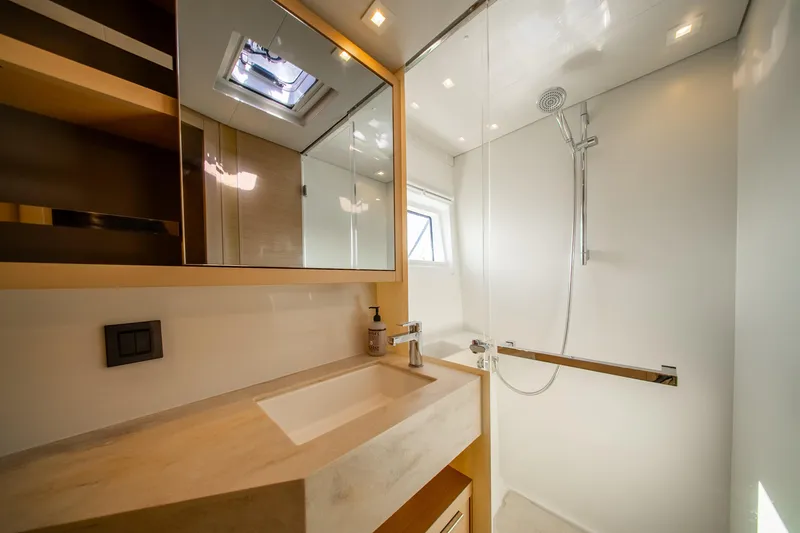 Slide: The Image of Modern bathroom in 2023 Lagoon 46 yacht with sleek shower and vanity. - 70