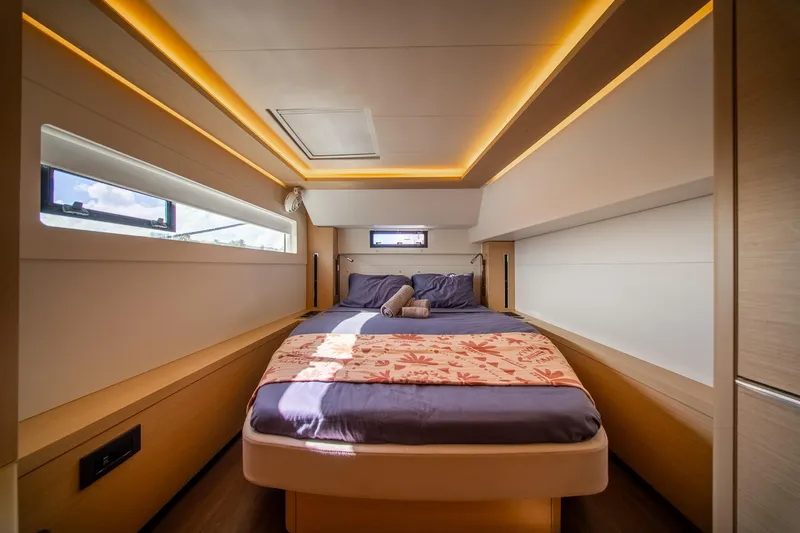 Slide: The Image of Luxurious interior of 2023 Lagoon 46 yacht with cozy bed and ambient lighting. - 72