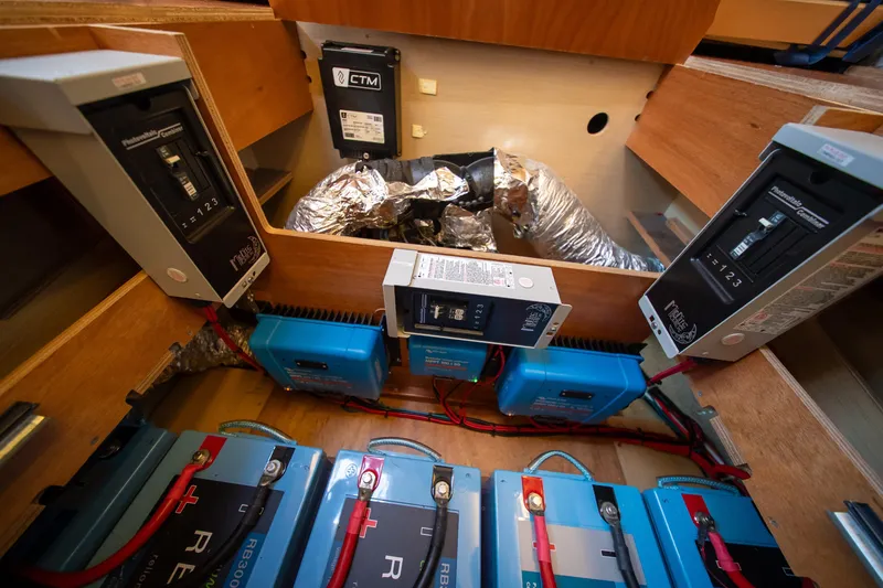 Slide: The Image of Electrical system of 2023 Lagoon 46 yacht, featuring batteries and circuit breakers. - 92