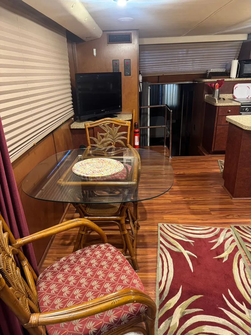Slide: The Image of Interior of a 2006 Gibson 5500 with dining area and kitchen. - 10