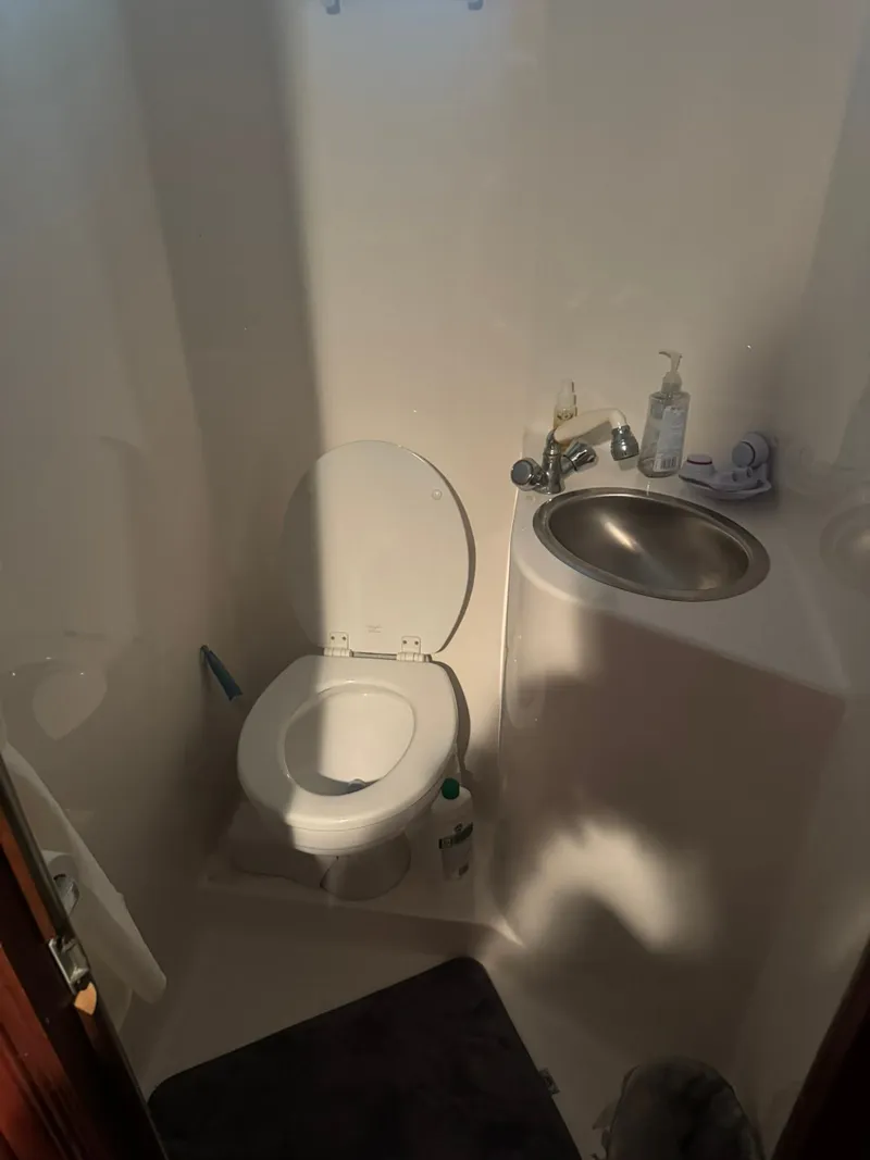 Slide: The Image of Compact bathroom in a 2006 Gibson 5500 boat. - 24