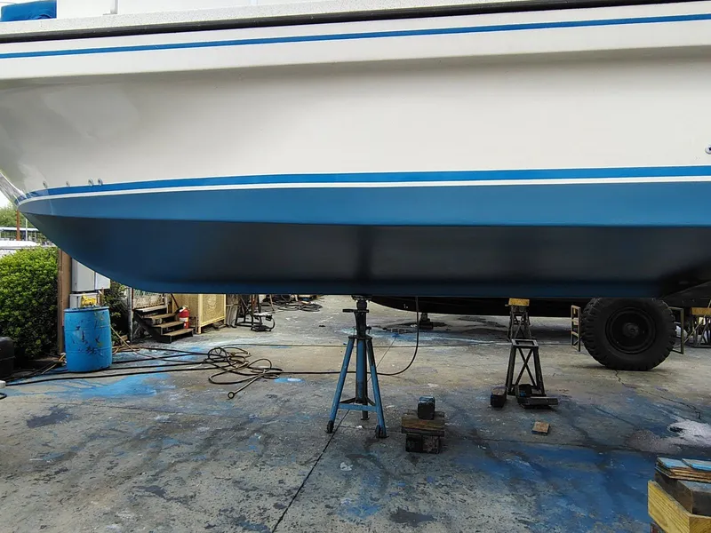 Slide: The Image of 2006 Gibson 5500 boat hull on stands in dry dock. - 31