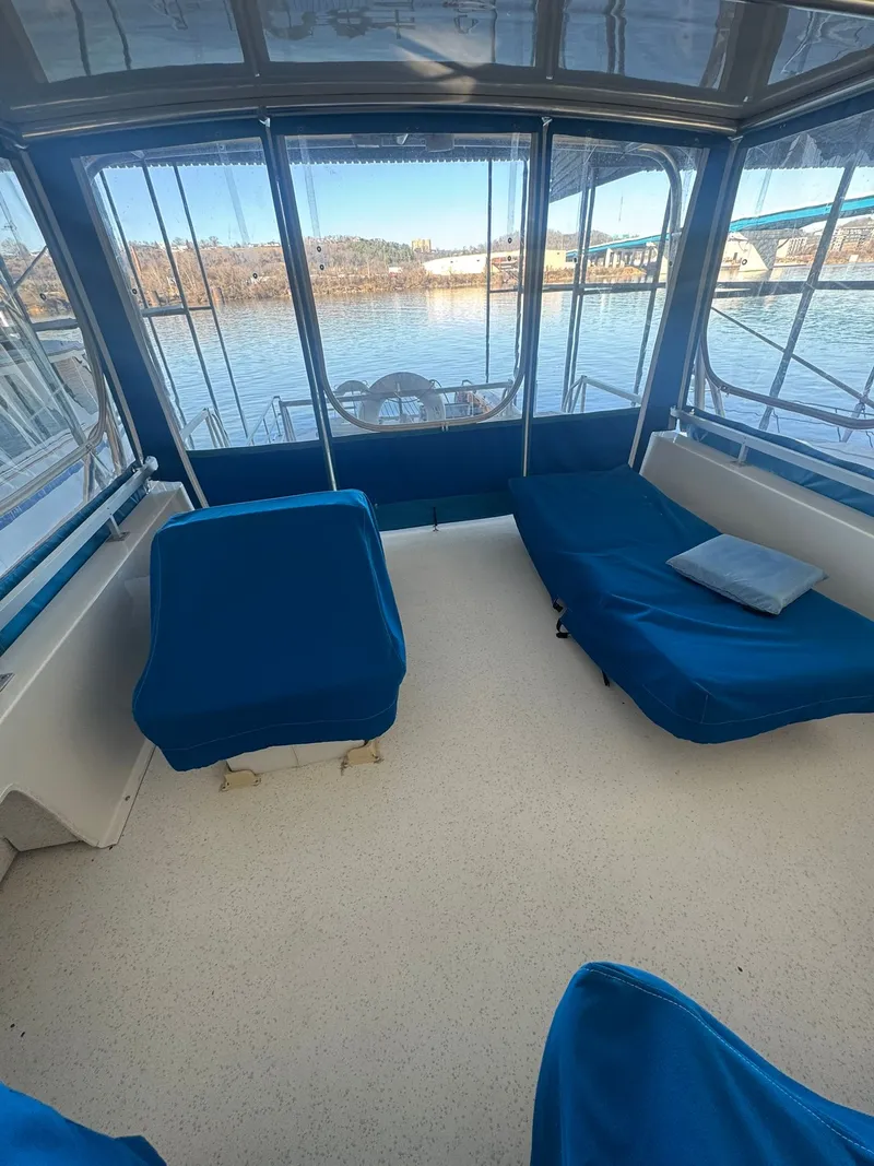 Slide: The Image of Interior of 2006 Gibson 5500 boat with blue seating. - 5
