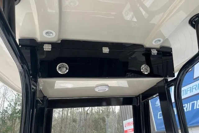 Slide: The Image of 2026 Key West 239 FSR boat interior, featuring sleek black storage compartment and modern lighting. - 18