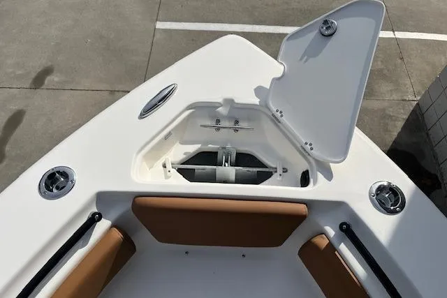 Slide: The Image of Bow view of 2026 Key West 239 FSR boat with open anchor compartment. - 31