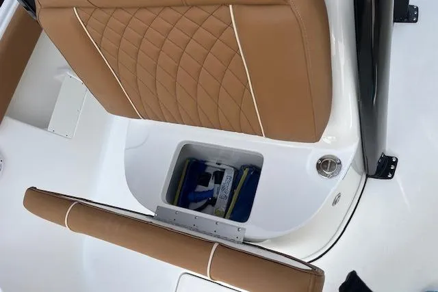 Slide: The Image of 2026 Key West 239 FSR boat seat with storage compartment, featuring tan upholstery. - 34