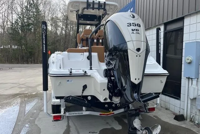 Slide: The Image of 2026 Key West 239 FSR boat with powerful 350 V6 engine, parked outdoors. - 4