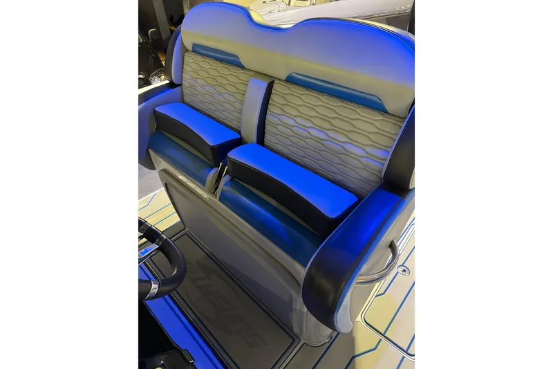 Slide: The Image of 2025 Sunsation 32 CCX boat interior with illuminated blue and gray seating. - 11