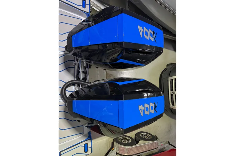 Slide: The Image of 2025 Sunsation 32 CCX boat engines, blue and black design. - 14