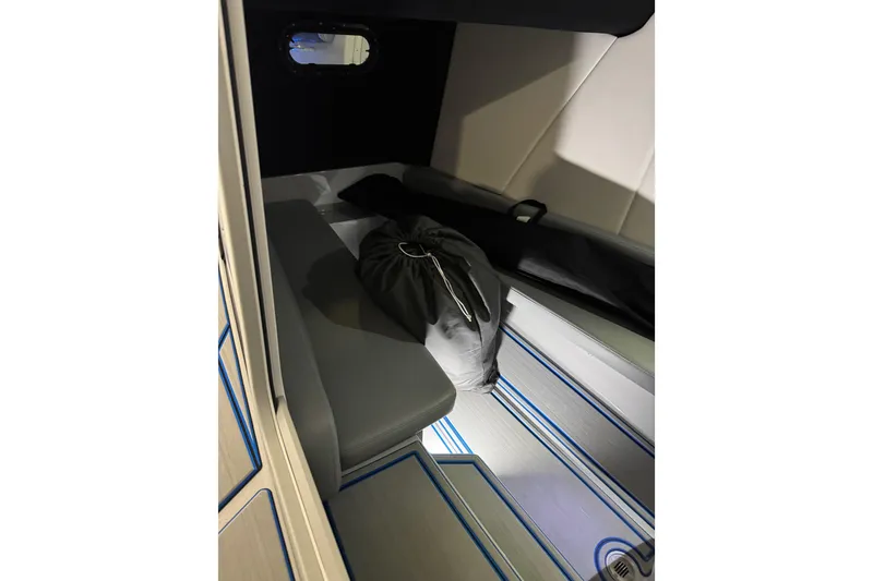 Slide: The Image of 2025 Sunsation 32 CCX cabin interior with seating and storage bag. - 15