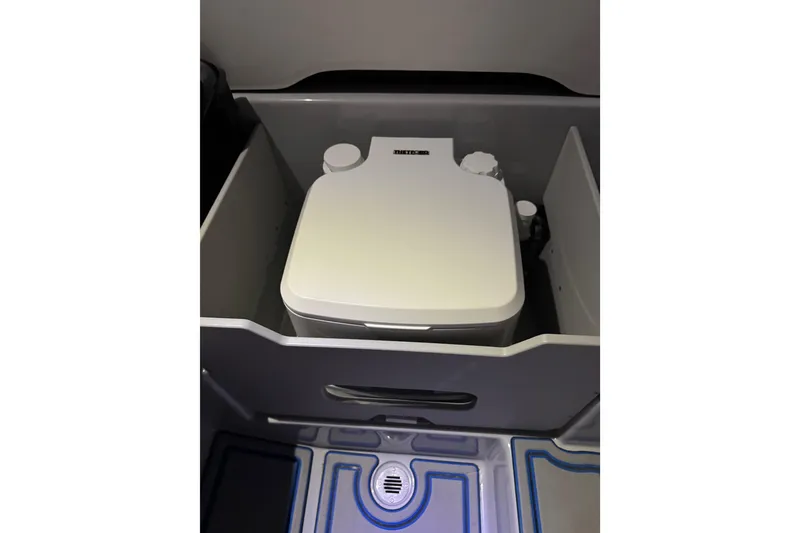 Slide: The Image of 2025 Sunsation 32 CCX boat interior with compact marine toilet. - 18