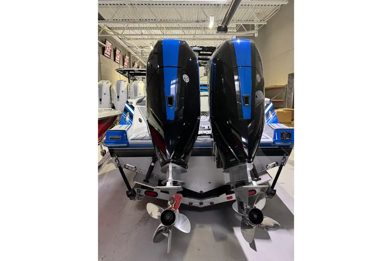 Slide: The Image of 2025 Sunsation 32 CCX boat with dual outboard motors in a showroom. - 19