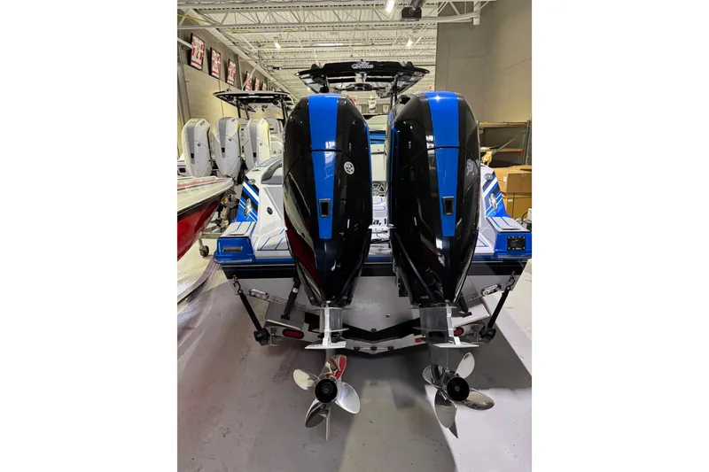 Slide: The Image of 2025 Sunsation 32 CCX boat with dual outboard engines in a showroom. - 20