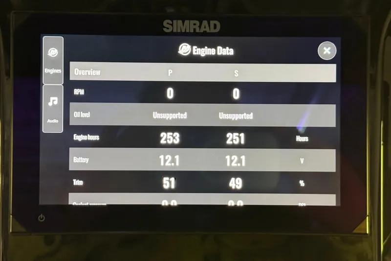Slide: The Image of Simrad engine data display on 2025 Sunsation 32 CCX showing RPM, engine hours, and battery voltage. - 22