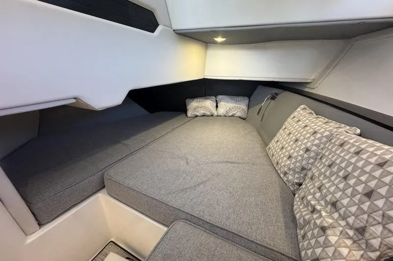 Slide: The Image of 2024 Cobalt R35 cabin interior with cozy bedding and modern design. - 16