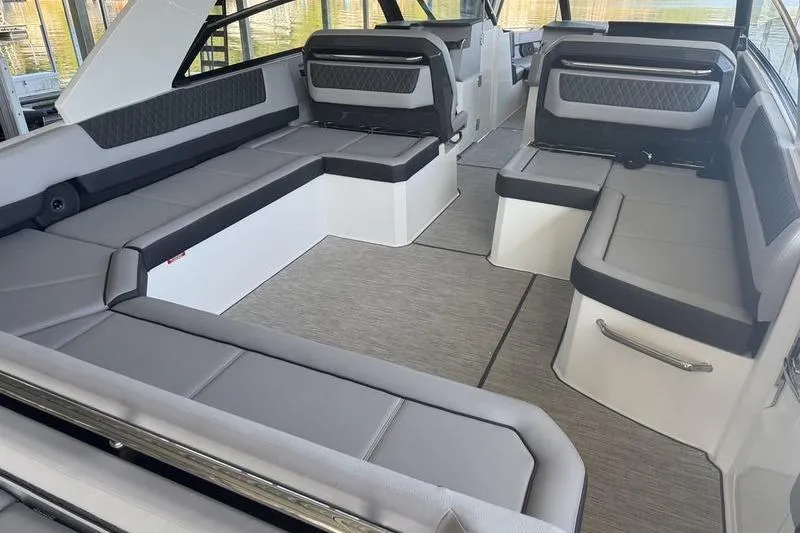 Slide: The Image of 2024 Cobalt R35 boat interior with spacious gray seating and modern design. - 5