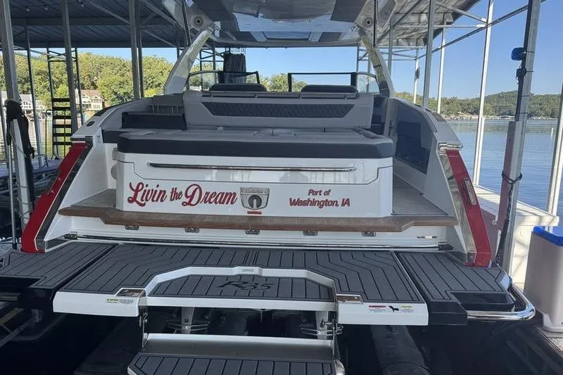 Slide: The Image of 2024 Cobalt R35 boat docked, featuring "Livin the Dream" text, Washington, IA. - 9