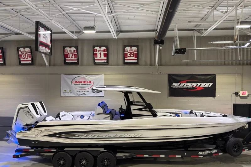 The Image of 2026 Sunsation 32 CCX powerboat in showroom, featuring sleek design and modern features. - 1