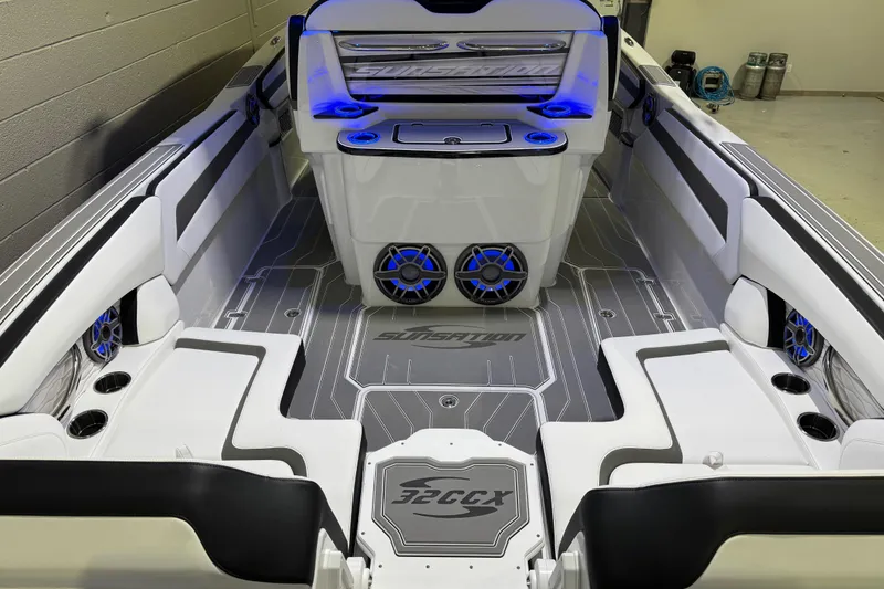 Slide: The Image of 2026 Sunsation 32 CCX boat interior with modern design, blue LED lighting, and premium seating. - 11