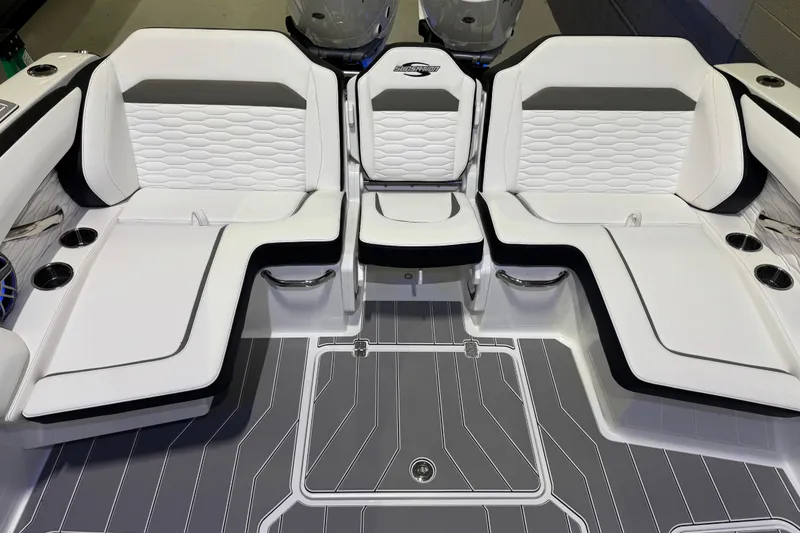 Slide: The Image of 2026 Sunsation 32 CCX boat interior with white cushioned seating and sleek design. - 12