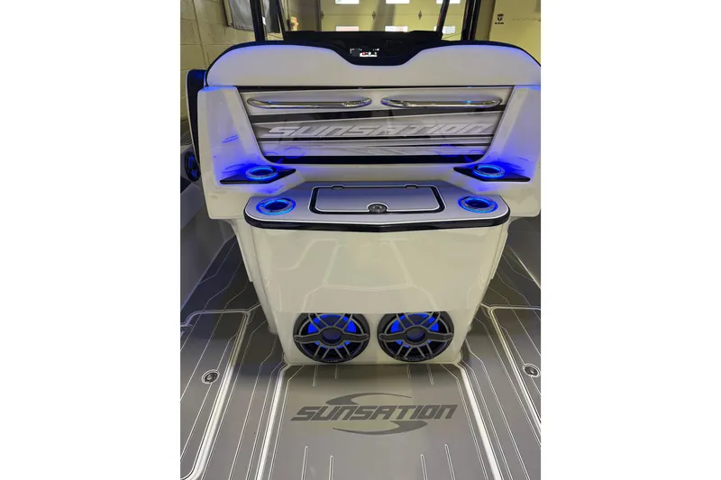 Slide: The Image of 2026 Sunsation 32 CCX boat interior with illuminated cup holders and speakers. - 14
