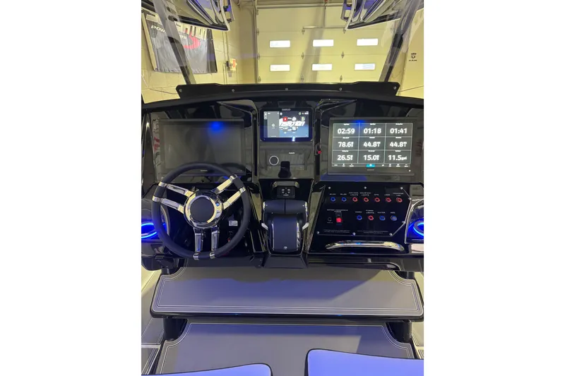 Slide: The Image of 2026 Sunsation 32 CCX boat dashboard with advanced digital displays and controls. - 15