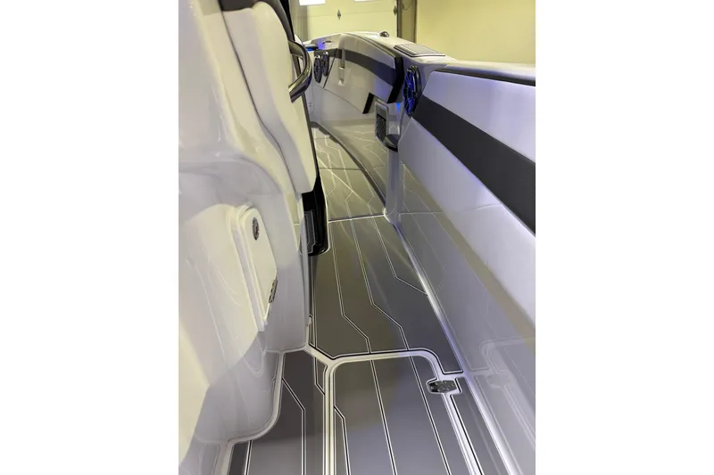 Slide: The Image of 2026 Sunsation 32 CCX boat interior with sleek, modern design and stylish flooring. - 16