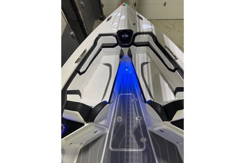 Slide: The Image of 2026 Sunsation 32 CCX boat interior with sleek seating and blue LED lighting. - 17