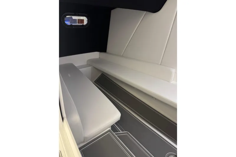 Slide: The Image of 2026 Sunsation 32 CCX cabin interior with sleek white seating and modern design. - 24