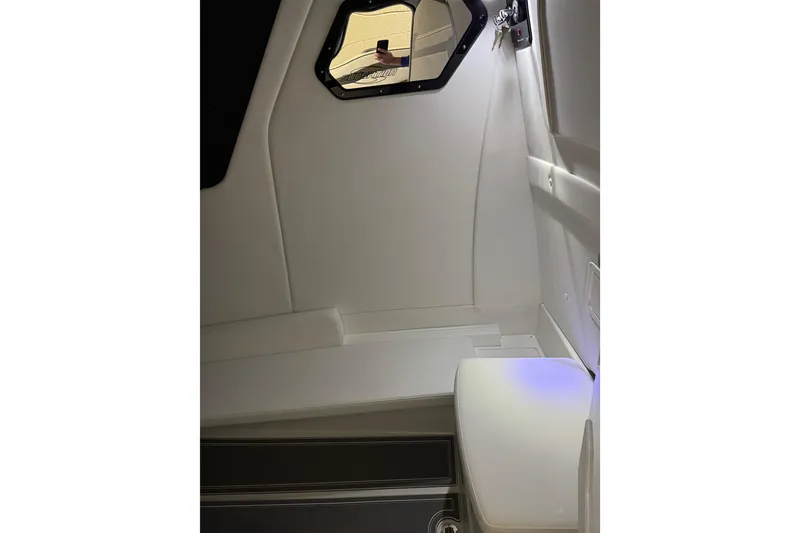 Slide: The Image of Interior of 2026 Sunsation 32 CCX boat, featuring sleek white design and modern lighting. - 25