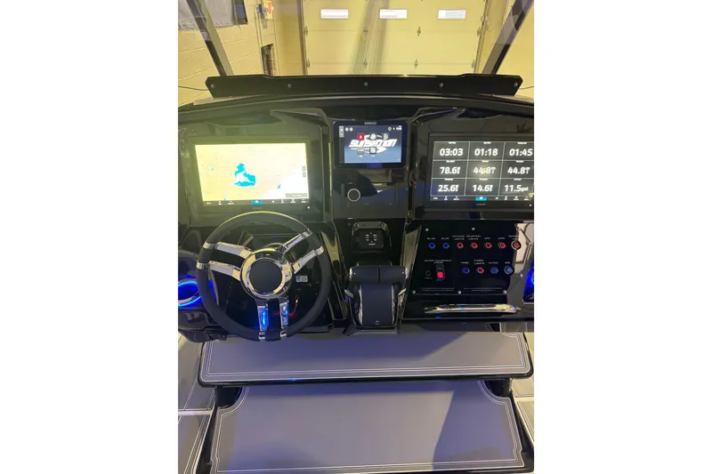 Slide: The Image of 2026 Sunsation 32 CCX dashboard with advanced navigation and control systems. - 26