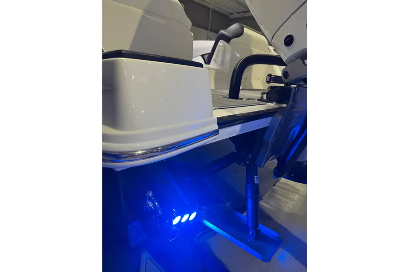 Slide: The Image of 2026 Sunsation 32 CCX boat with illuminated blue underwater lights. - 27
